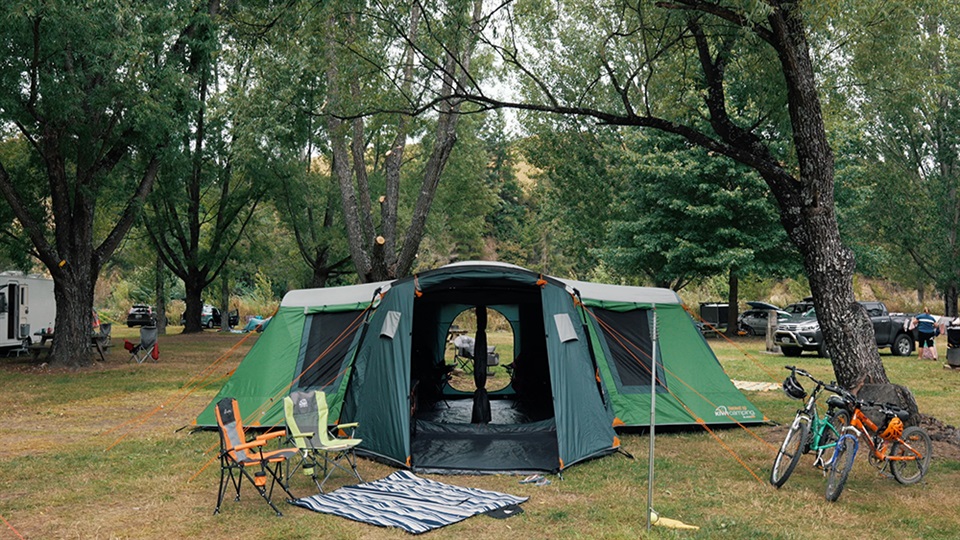 takahe 10 blackout family tent pitched under a tree canopy in quinneys bush south island